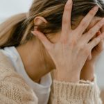 Person experiencing anxiety and stress representing mental health treatment options in Canada including therapy and telehealth.