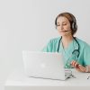 Healthcare provider conducting online doctor consultation in Ontario using laptop and headset