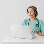 Healthcare provider conducting online doctor consultation in Ontario using laptop and headset