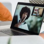 Person attending online therapy session in Toronto via laptop with licensed mental health provider