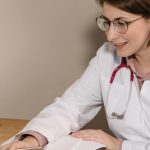Psychiatrist in Toronto providing online therapy and ADHD assessment through virtual consultation on laptop.